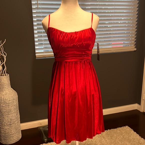 - Red satin lined strapless mini. Flowy bottom with adjustable straps. - Picture 1 of 7